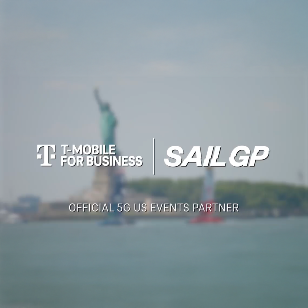 Stylized blue and pink image of a whiskey glass with the wordmark of Vèloce in pink all-caps letters above.